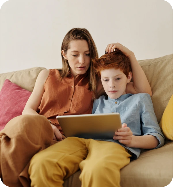 Son with her mother checking live streaming video